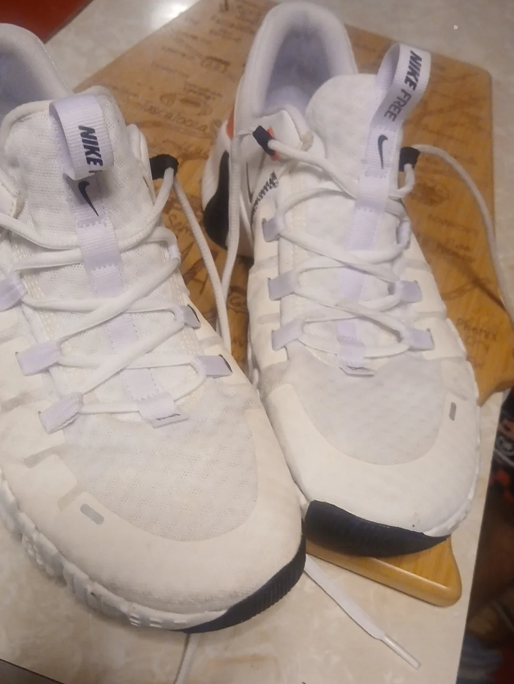 Nike Men’s White Athletic Shoes with Orange and Black Accents
